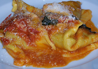 Eggplant-filled ravili with tomato and basil at Drogheria della Rosa, Bologna.