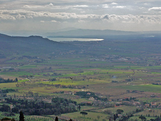 Scenic landscape from Cortona with Lago Trasimeno in the distance.